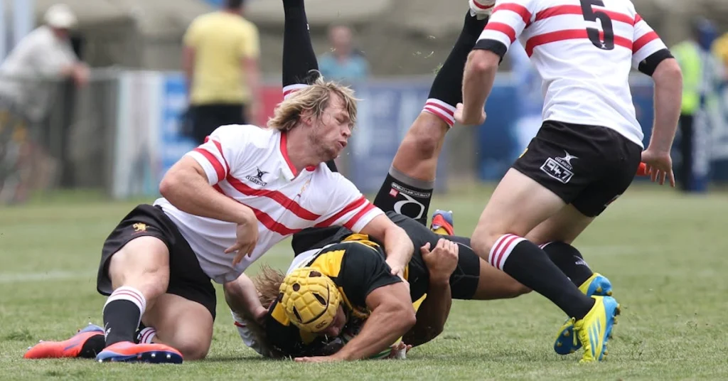 Men playing rugby